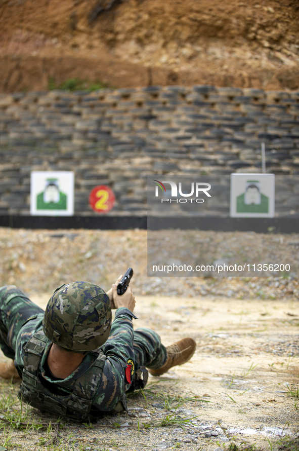 Special forces soldiers are performing an automatic rifle firing test on fixed targets in Baise, Guangxi province, China, on June 20, 2024. 