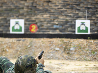 Special forces soldiers are performing an automatic rifle firing test on fixed targets in Baise, Guangxi province, China, on June 20, 2024....