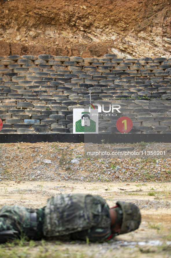 Special forces soldiers are performing an automatic rifle firing test on fixed targets in Baise, Guangxi province, China, on June 20, 2024. 