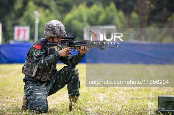 Special forces soldiers are performing an automatic rifle firing test on fixed targets in Baise, Guangxi province, China, on June 20, 2024. 