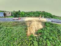 Workers are driving machinery and equipment to clear landslide soil at the site of a landslide in Datong Township on G242 National Highway i...