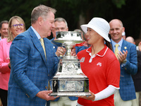 Amy Yang of Republic of Korea is presented with the trophy by the president of the PGA John Lindert after winning the KPMG Women's PGA Champ...