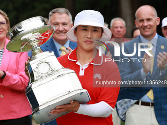 Amy Yang of Republic of Korea holds up the trophy after winning the KPMG Women's PGA Championship at Sahalee Country Club in Sammamish, Wash...