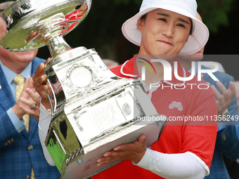 Amy Yang of Republic of Korea holds up the trophy after winning the KPMG Women's PGA Championship at Sahalee Country Club in Sammamish, Wash...