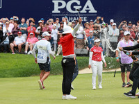 Amy Yang of Republic of Korea is showered with sparkling wine by her peers after winning the KPMG Women's PGA Championship at Sahalee Countr...