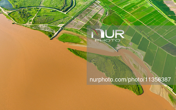 A view is overlooking the Yinchuan section of the Yellow River in Yinchuan, capital of Northwest China's Ningxia Hui autonomous region, in W...