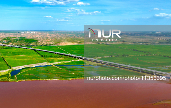 A view is overlooking the Yinchuan section of the Yellow River in Yinchuan, capital of Northwest China's Ningxia Hui autonomous region, in W...