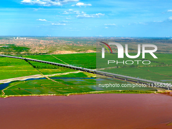 A view is overlooking the Yinchuan section of the Yellow River in Yinchuan, capital of Northwest China's Ningxia Hui autonomous region, in W...