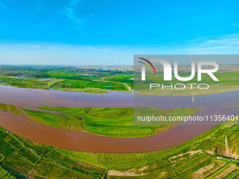 A view is overlooking the Yinchuan section of the Yellow River in Yinchuan, capital of Northwest China's Ningxia Hui autonomous region, in W...