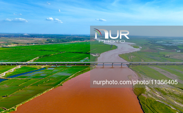 A view is overlooking the Yinchuan section of the Yellow River in Yinchuan, capital of Northwest China's Ningxia Hui autonomous region, in W...