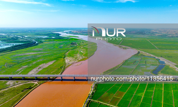 A view is overlooking the Yinchuan section of the Yellow River in Yinchuan, capital of Northwest China's Ningxia Hui autonomous region, in W...