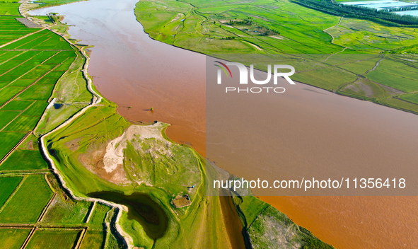 A view is overlooking the Yinchuan section of the Yellow River in Yinchuan, capital of Northwest China's Ningxia Hui autonomous region, in W...