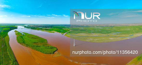 A view is overlooking the Yinchuan section of the Yellow River in Yinchuan, capital of Northwest China's Ningxia Hui autonomous region, in W...