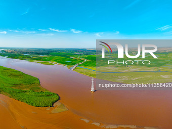 A view is overlooking the Yinchuan section of the Yellow River in Yinchuan, capital of Northwest China's Ningxia Hui autonomous region, in W...