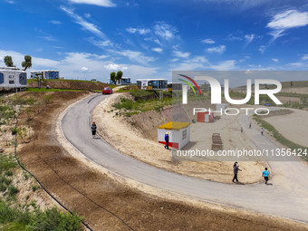 Tourists are playing at the ''space capsule camp'' in Ganjing village, Guyuan city, Northwest China's Ningxia Hui Autonomous region, on June...