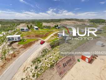 Tourists are playing at the ''space capsule camp'' in Ganjing village, Guyuan city, Northwest China's Ningxia Hui Autonomous region, on June...