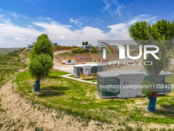 Tourists are playing at the ''space capsule camp'' in Ganjing village, Guyuan city, Northwest China's Ningxia Hui Autonomous region, on June...