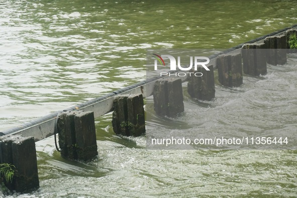 Shengtang Gate is releasing water from the West Lake in Hangzhou, China, on June 24, 2024. On the same day, the National Meteorological Cent...