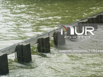 Shengtang Gate is releasing water from the West Lake in Hangzhou, China, on June 24, 2024. On the same day, the National Meteorological Cent...