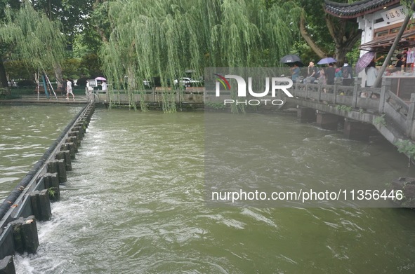 Shengtang Gate is releasing water from the West Lake in Hangzhou, China, on June 24, 2024. On the same day, the National Meteorological Cent...