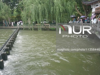 Shengtang Gate is releasing water from the West Lake in Hangzhou, China, on June 24, 2024. On the same day, the National Meteorological Cent...