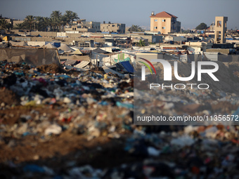 A general view is showing tents housing internally displaced Palestinians crowding the beach and the Mediterranean shoreline in Deir el-Bala...