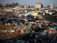 A general view is showing tents housing internally displaced Palestinians crowding the beach and the Mediterranean shoreline in Deir el-Bala...