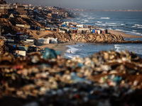 A general view is showing tents housing internally displaced Palestinians crowding the beach and the Mediterranean shoreline in Deir el-Bala...