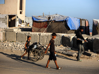 Displaced Palestinians are being seen on the beach in Deir el-Balah in the central Gaza Strip on June 24, 2024, amid the ongoing conflict be...