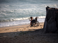 Displaced Palestinian children are being seen on the beach in Deir el-Balah in the central Gaza Strip on June 24, 2024, amid the ongoing con...