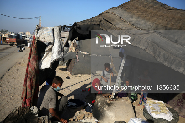 Displaced Palestinians are baking bread in Deir el-Balah, in the central Gaza Strip, on June 24, 2024, amid the ongoing conflict between Isr...