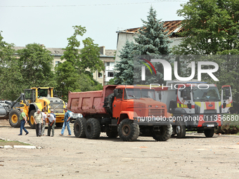 Trucks are being pictured at the Ivano-Frankivsk National Technical University of Oil and Gas, damaged by a Russian missile attack, in Ivano...