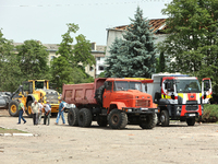 Trucks are being pictured at the Ivano-Frankivsk National Technical University of Oil and Gas, damaged by a Russian missile attack, in Ivano...