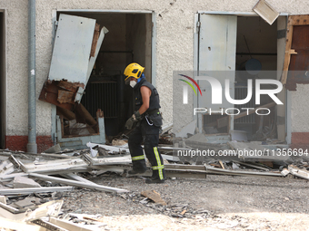 A rescuer is removing the rubble at the Ivano-Frankivsk National Technical University of Oil and Gas, damaged by a Russian missile attack, i...