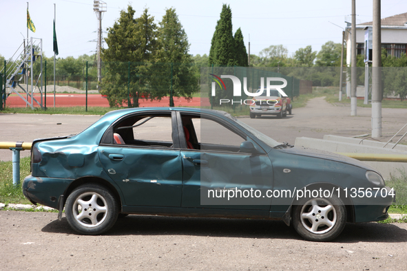 A car is being pictured at the Ivano-Frankivsk National Technical University of Oil and Gas, damaged by a Russian missile attack, in Ivano-F...