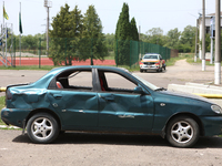 A car is being pictured at the Ivano-Frankivsk National Technical University of Oil and Gas, damaged by a Russian missile attack, in Ivano-F...