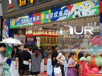 Chinese and foreign tourists are bustling along the Nanjing Road Pedestrian street in Shanghai, China, on June 24, 2024. (