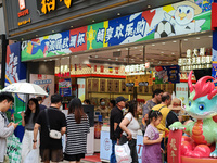 Chinese and foreign tourists are bustling along the Nanjing Road Pedestrian street in Shanghai, China, on June 24, 2024. (