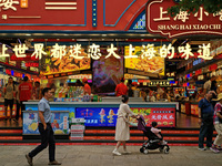 Chinese and foreign tourists are bustling along the Nanjing Road Pedestrian street in Shanghai, China, on June 24, 2024. (