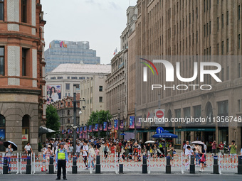 Chinese and foreign tourists are bustling along the Nanjing Road Pedestrian street in Shanghai, China, on June 24, 2024. (