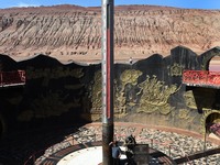 Tourists are visiting the Flaming Mountain scenic spot in Turpan, Xinjiang province, China, on June 24, 2024. A golden stick-shaped thermome...