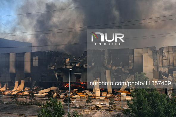 Smoke is rising from a warehouse destroyed as a result of a Russian missile strike in Odesa, Ukraine, on June 24, 2024. NO USE RUSSIA. NO US...