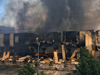 Smoke is rising from a warehouse destroyed as a result of a Russian missile strike in Odesa, Ukraine, on June 24, 2024. NO USE RUSSIA. NO US...