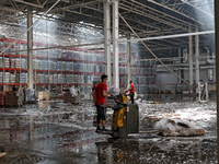 Workers are removing the debris in a warehouse damaged by a Russian missile strike in Odesa, Ukraine, on June 24, 2024. NO USE RUSSIA. NO US...