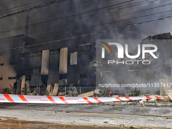 Smoke is rising from a warehouse destroyed as a result of a Russian missile strike in Odesa, Ukraine, on June 24, 2024. NO USE RUSSIA. NO US...