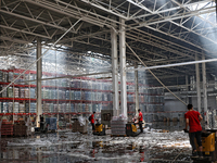 Workers are removing the debris in a warehouse damaged by a Russian missile strike in Odesa, Ukraine, on June 24, 2024. NO USE RUSSIA. NO US...