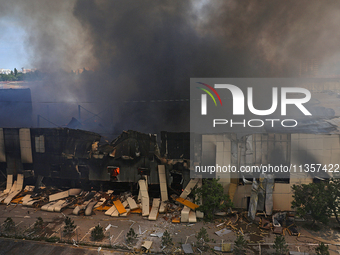 Smoke is rising from a warehouse destroyed as a result of a Russian missile strike in Odesa, Ukraine, on June 24, 2024. NO USE RUSSIA. NO US...