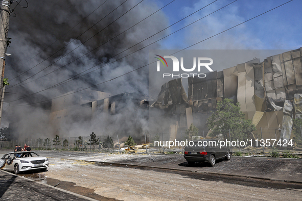 Smoke is rising from a warehouse destroyed as a result of a Russian missile strike in Odesa, Ukraine, on June 24, 2024. NO USE RUSSIA. NO US...