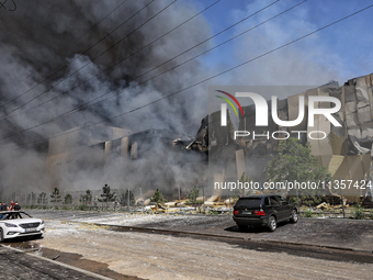 Smoke is rising from a warehouse destroyed as a result of a Russian missile strike in Odesa, Ukraine, on June 24, 2024. NO USE RUSSIA. NO US...