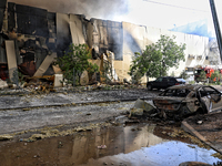 A destroyed car is being pictured outside a warehouse destroyed by a Russian missile attack in Odesa, Ukraine, on June 24, 2024. NO USE RUSS...